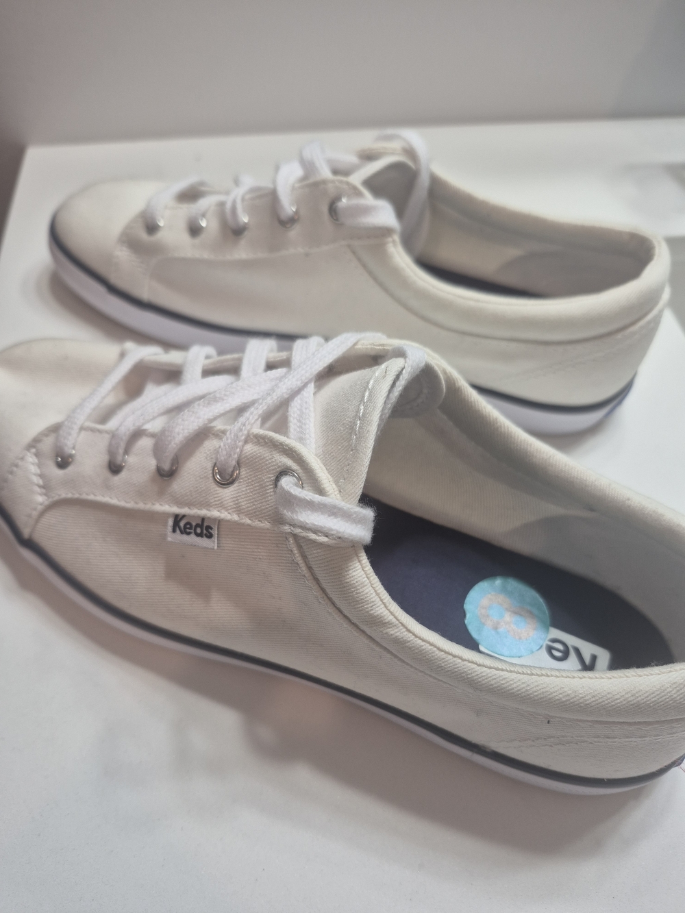 Keds Canvas Low-Top Sneakers in White with Navy Trim